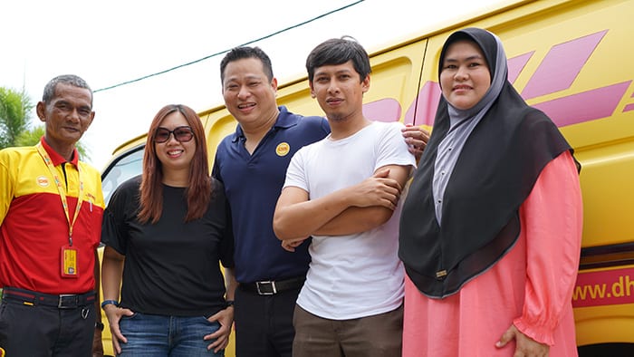 Hanan Asyraf with the DHL logistics team.