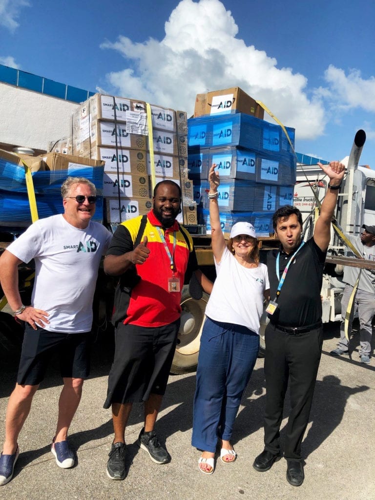 All smiles from DHL and smartAID after receiving the aid relief items