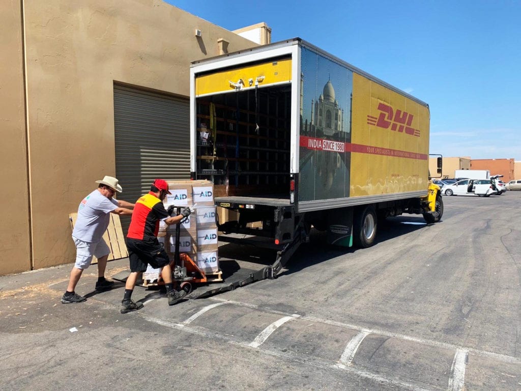 DHL couriers picking up hygiene packs and solar sheets from San Diego, U.S.