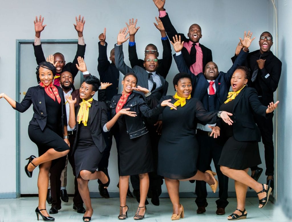 Shuvai Mugadza (front row, second from right) with her team