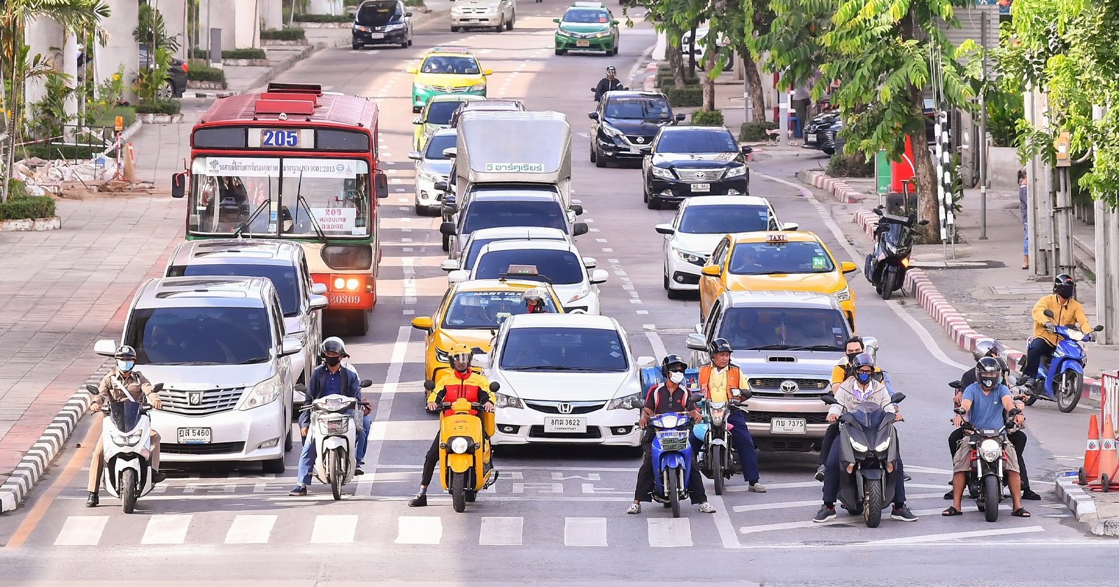 A DHL Express Thailand electric motorcycle on the streets of Bangkok, Thailand