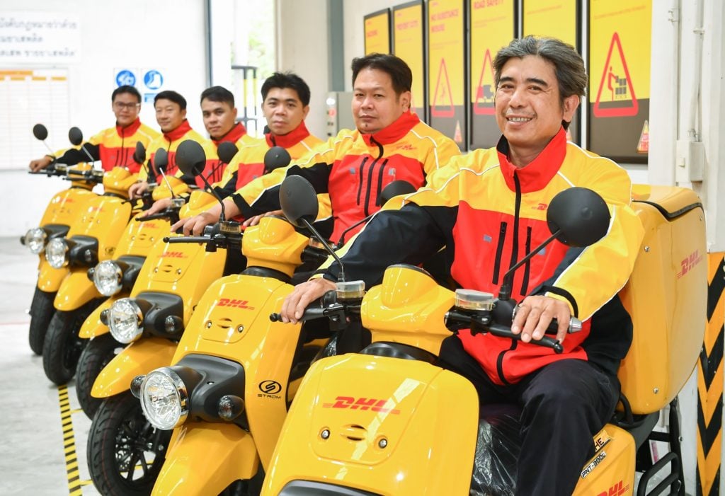 Couriers from DHL Express Thailand with their new electric motorcycles