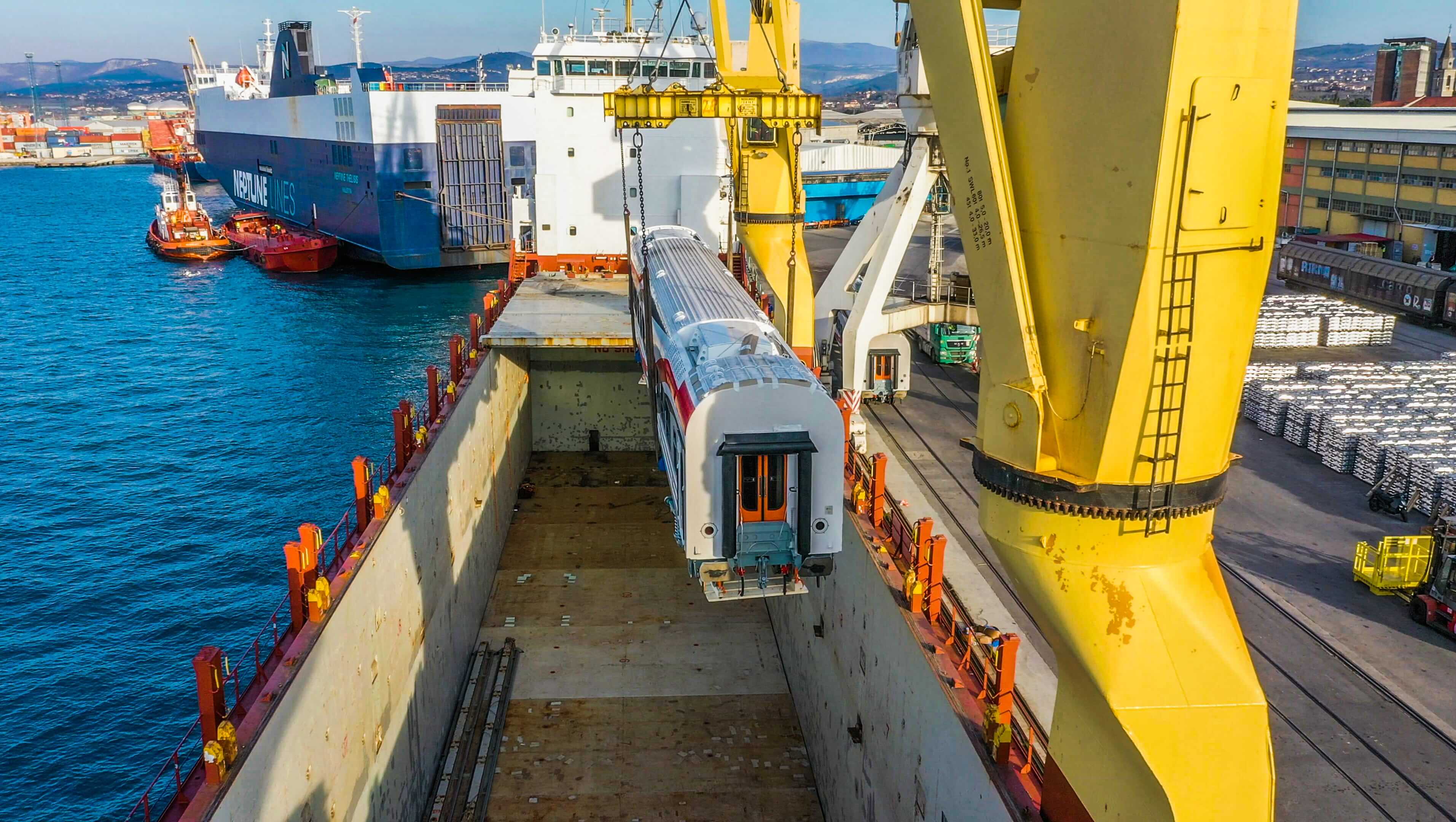 One of the rail coaches being lifted onto the vessel at the port