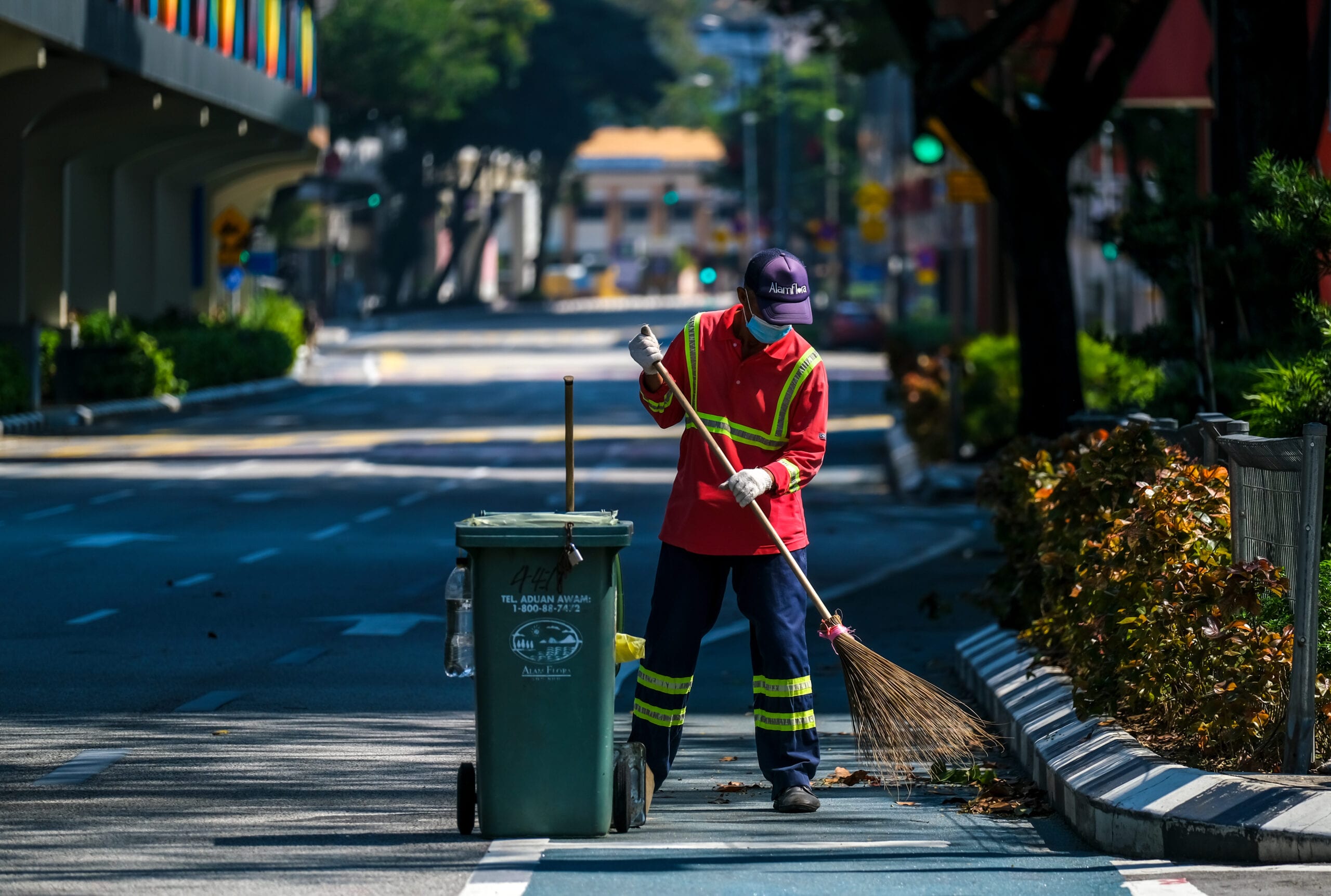 A worker cleaning Kuala Lumpur’s empty streets during Malaysia’s Movement Control Order (MCO) lockdown last year