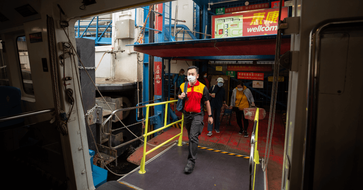 Walker couriers take ferry trips to deliver to remote islands in Hong Kong's terrain.